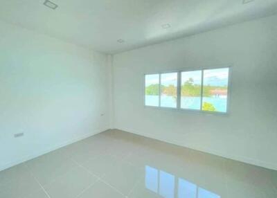 Spacious unfurnished bedroom with large windows and ample natural light