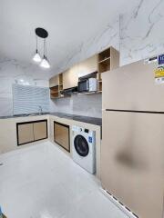 Modern kitchen with built-in appliances and ample cabinet space