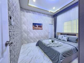 Modern bedroom with a stylish interior design and comfortable bedding