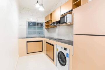 Compact modern kitchen with washing machine