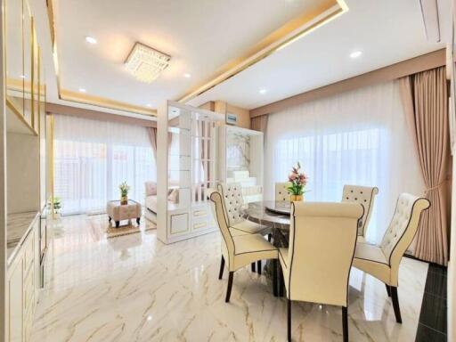 Elegant dining room with modern furnishings and abundant natural light