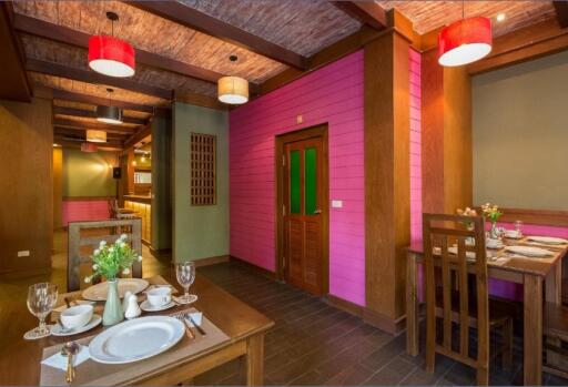 Cozy dining room with wooden furniture and colorful walls