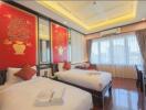 Elegant and bright bedroom with traditional red artwork