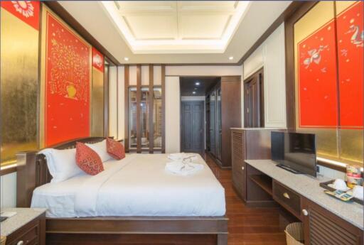 Elegant bedroom with traditional decor and modern amenities