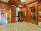 Elegant wooden hallway with decorative carpet and ornate doors