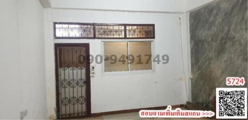 Front view of a house entrance with security door and window