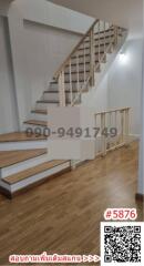 Modern wooden staircase in a well-lit interior