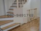 Modern wooden staircase in a well-lit interior