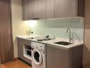 Compact modern kitchen with integrated appliances