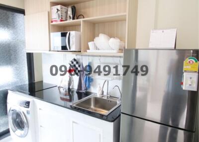 Modern compact kitchen with stainless steel appliances and open shelving