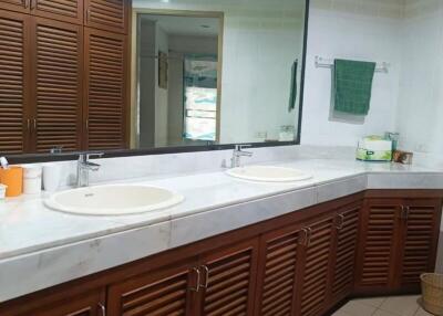 Spacious bathroom with double vanity and large mirror