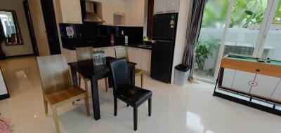 Modern kitchen with dining area and tiled floors