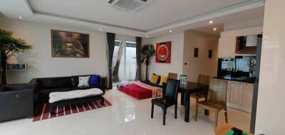 Spacious open-plan living room with adjoining kitchen