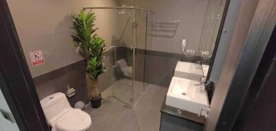 Modern bathroom with glass shower enclosure and sleek design