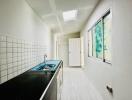 Modern kitchen with white subway tiles and natural light