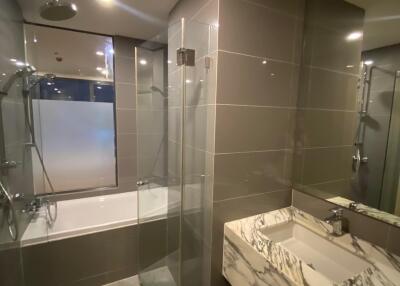 Modern bathroom interior with walk-in shower and elegant vanity