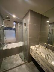 Modern bathroom interior with walk-in shower and elegant vanity