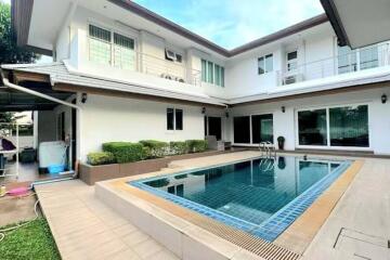 Two-story house with a swimming pool