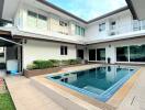 Two-story house with a swimming pool