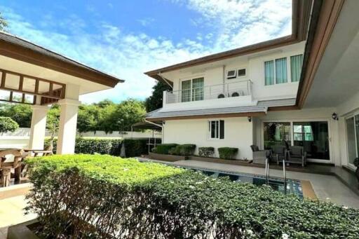 Spacious two-story house with pool and lush garden