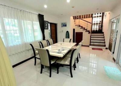 Spacious dining room with stairs leading to the second level