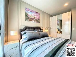 Cozy bedroom with a double bed and wall art