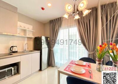 Modern kitchen with dining area and large window