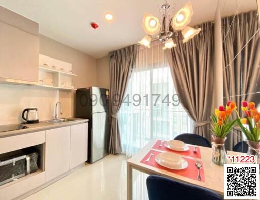 Modern kitchen with dining area and large window