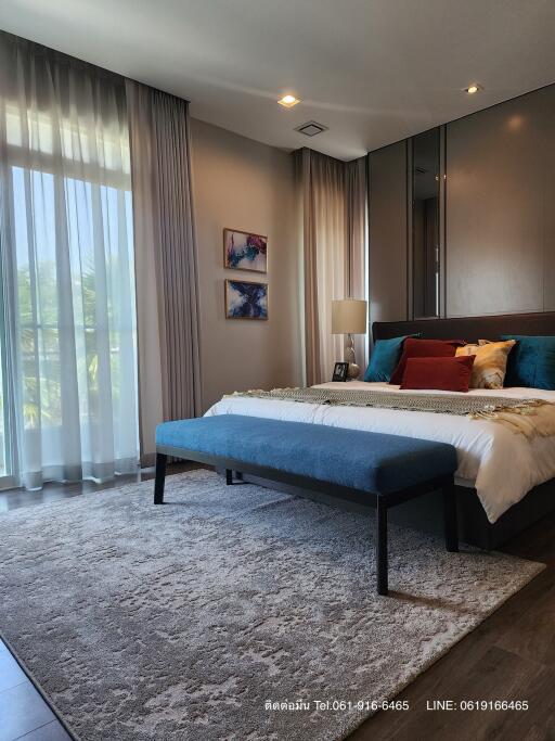 Elegant bedroom with modern design and ample natural light
