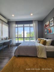 Bright and elegant bedroom with a comfortable bed and a view