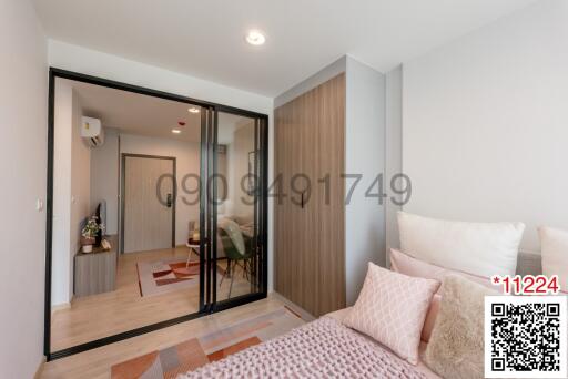 Cozy bedroom with sliding glass door, wooden flooring, and modern design
