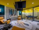 Modern living area with vibrant yellow walls, comfortable seating, and stylish decor
