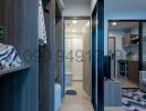 Modern hallway view with built-in shelves leading towards the interior of an apartment