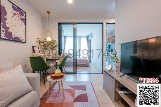 Cozy and well-lit living room with modern decor and balcony access