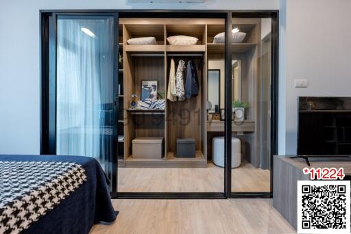 Modern bedroom with a large wardrobe and glass sliding doors