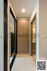 Modern corridor inside a residential property with wooden doors and tiled flooring