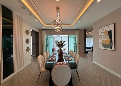 Modern dining room with artistic lighting and decor