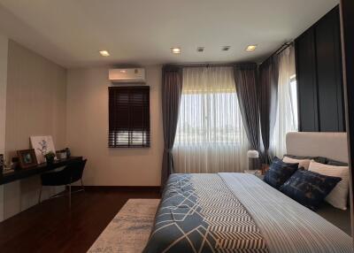 Cozy and well-designed bedroom interior with ample lighting