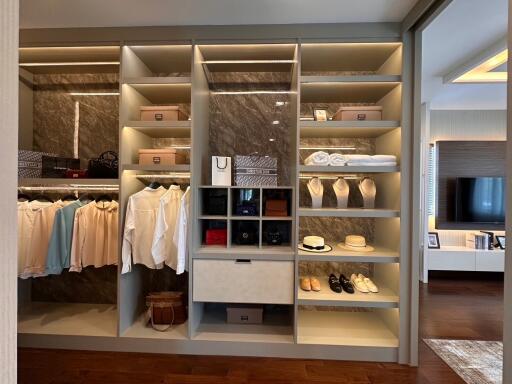 Elegant walk-in closet with ample shelving and organized wardrobe