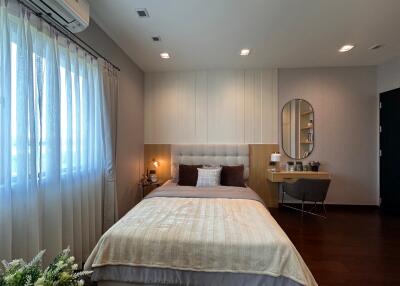 Modern bedroom with ample natural light and elegant interior design