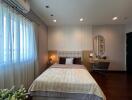 Modern bedroom with ample natural light and elegant interior design