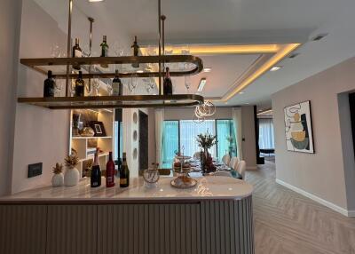 Modern kitchen with stylish bar and lighting fixtures