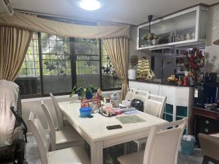 Spacious dining room with large window and ample natural light