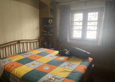 Cozy bedroom with a large bed and natural lighting