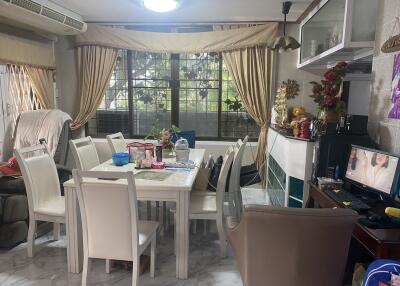 Spacious dining room with natural light and modern furnishings