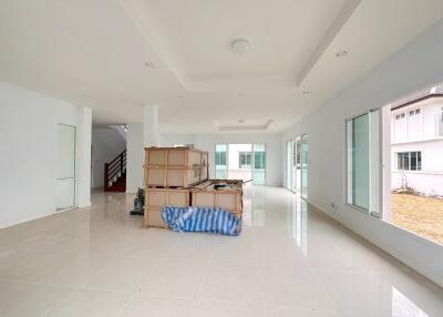 Spacious unfurnished living area with large windows and ample natural light