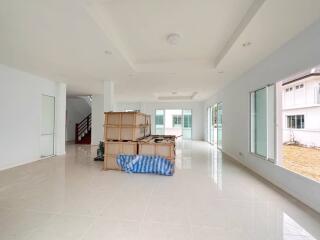 Spacious unfurnished living area with large windows and ample natural light