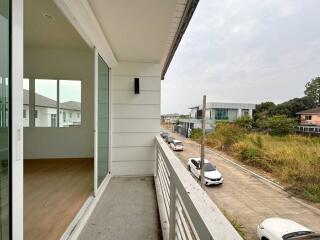 Spacious balcony with a street view in a residential neighborhood