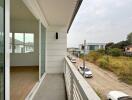 Spacious balcony with a street view in a residential neighborhood