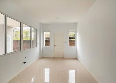 Bright and spacious empty bedroom with large windows